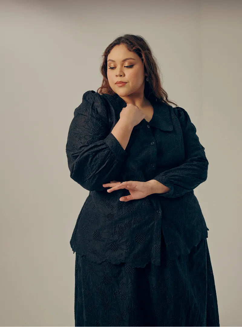 A woman dressed in All Black Tun Habiba Eyelet Set