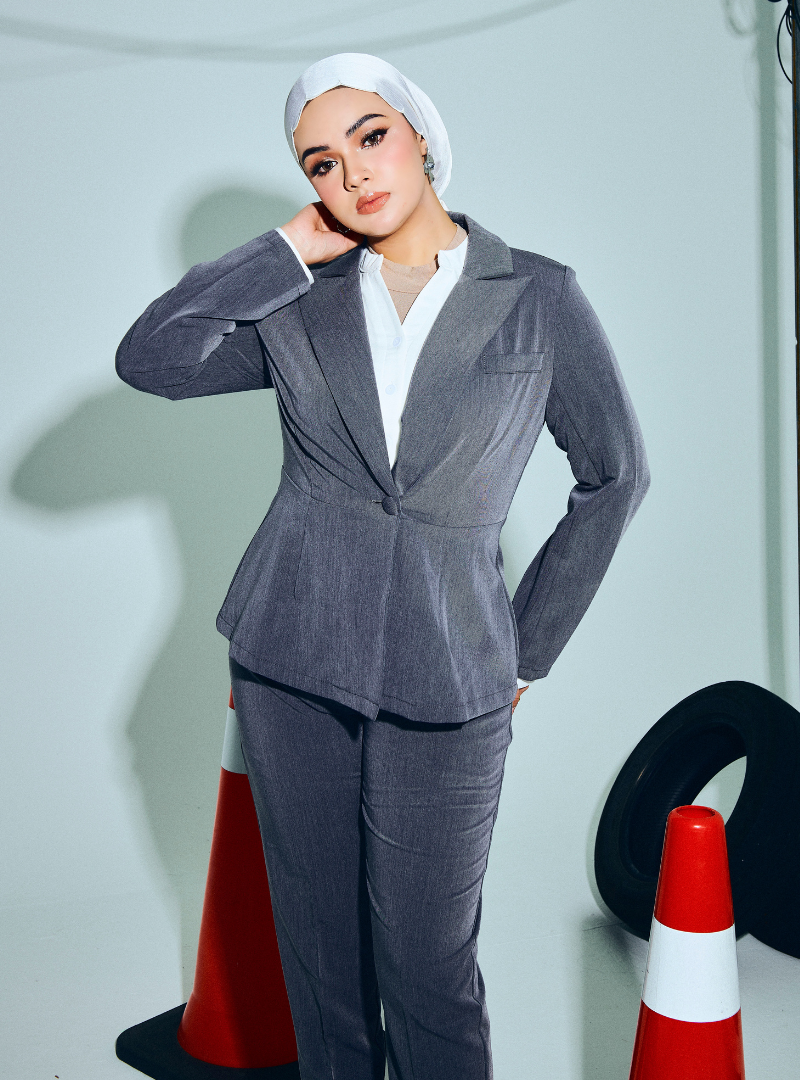 A woman wearing in Ash Grey Amber Peplum Blazer