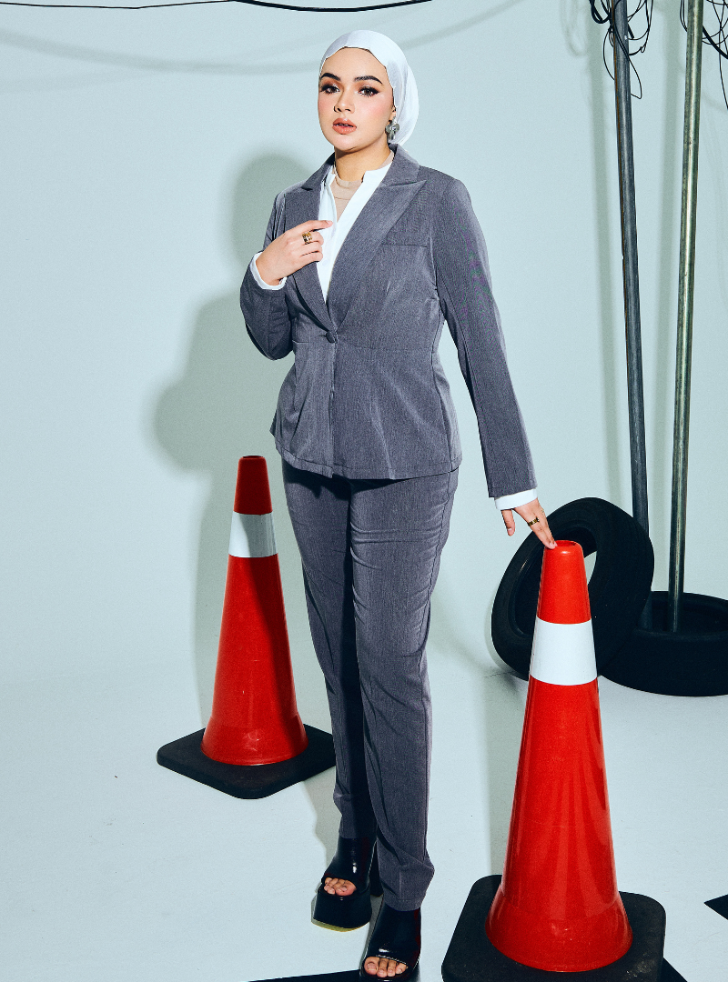 A woman wearing in Ash Grey Amber Peplum Blazer