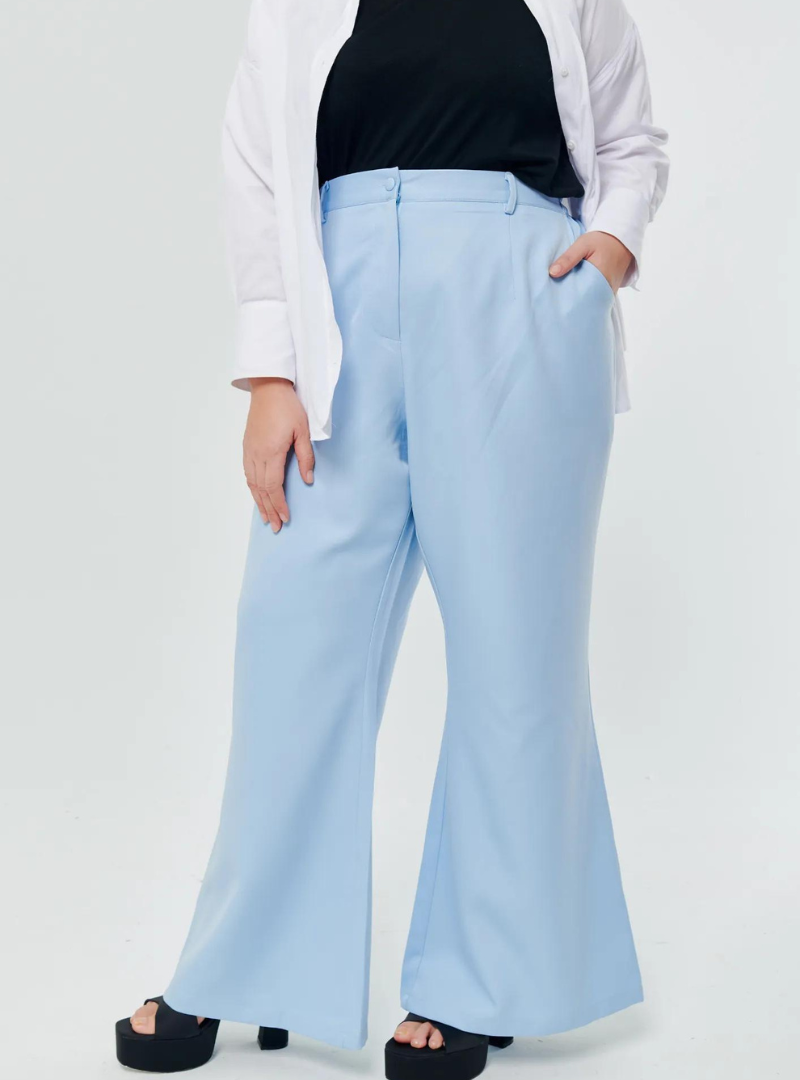 A woman wearing Baby Blue Bootcut Tuxedo Trouser