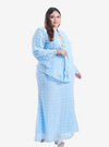 A woman wearing Baby Blue Misha Kurung