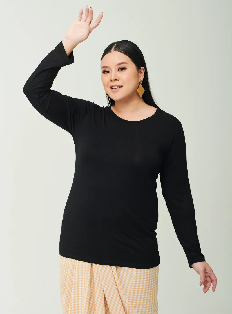 A woman dressed in Black Cotton Basic Inner Top