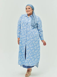 A woman dressed in Baby Blue Daisy Longline Printed Shirt Dress