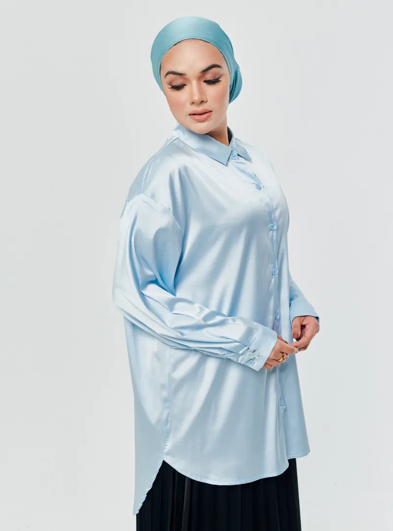 A woman dressed in Baby Blue Dropped Shoulder Satin Shirt