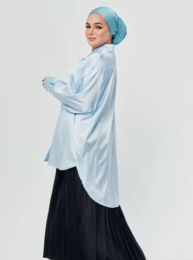 A woman dressed in Baby Blue Dropped Shoulder Satin Shirt