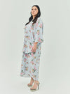 A woman dressed in Baby Blue Lily The Vintage Opah Kurung