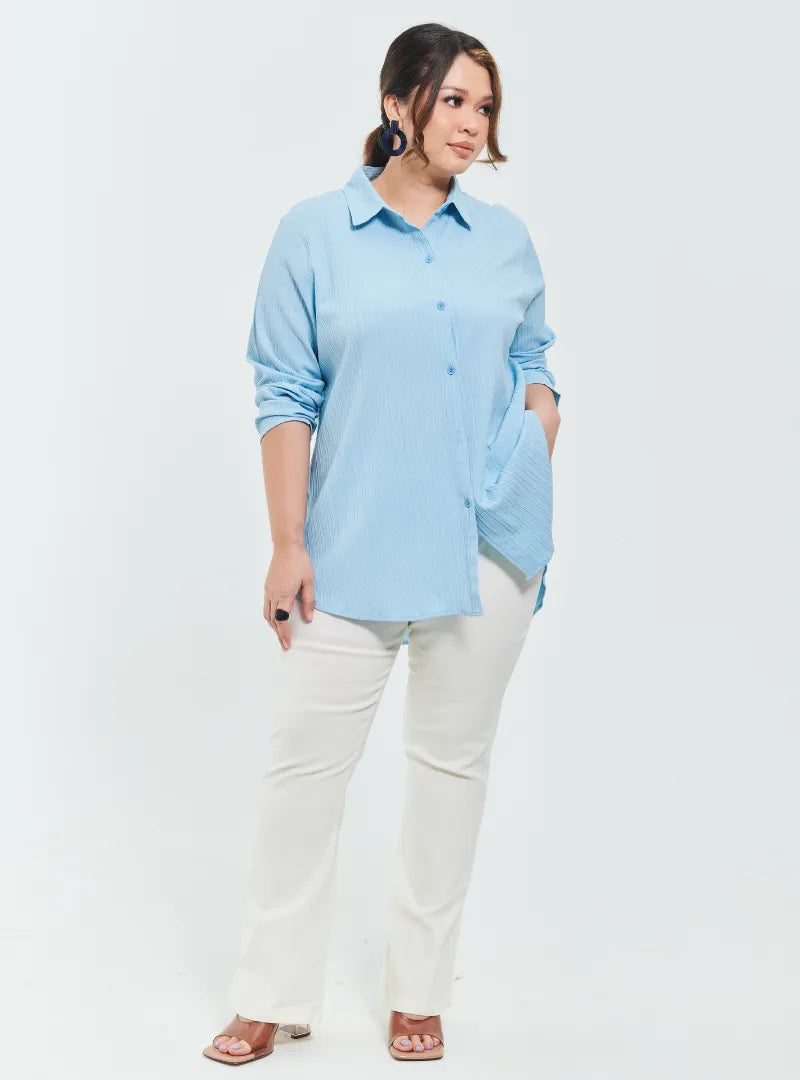 A woman dressed in Baby Blue Textured Shirt