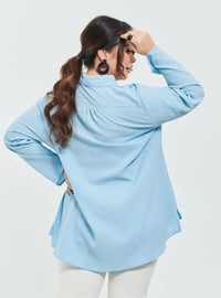 A woman dressed in Baby Blue Textured Shirt