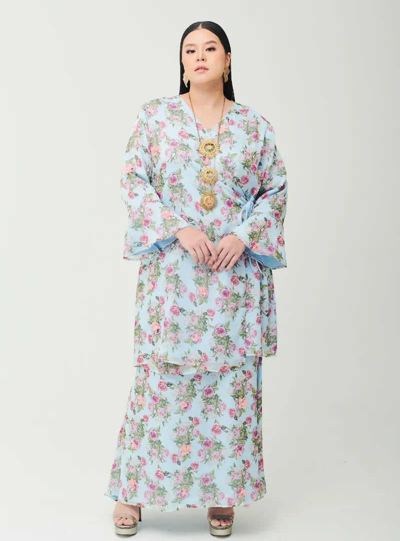 A woman dressed in Baby Blue Tun Salma 3D Chiffon Fleur Wrap-