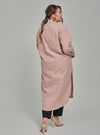 A woman dressed in Baby Salmon Longline Oversized Cotton Shirt Dress