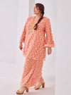 A woman dressed in Baby Salmon Tun Sharifah Lace Kurung