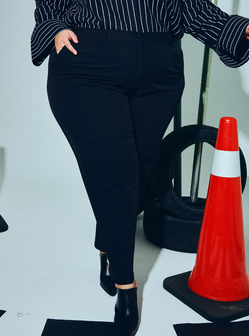 A woman wearing in Black Audrey Skinny Slacks