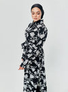 A woman dressed in Black Chrysanthemum Longline Printed Shirt Dress