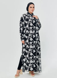 A woman dressed in Black Chrysanthemum Longline Printed Shirt Dress