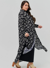 A woman dressed in Black Daisy Longline Printed Shirt Dress