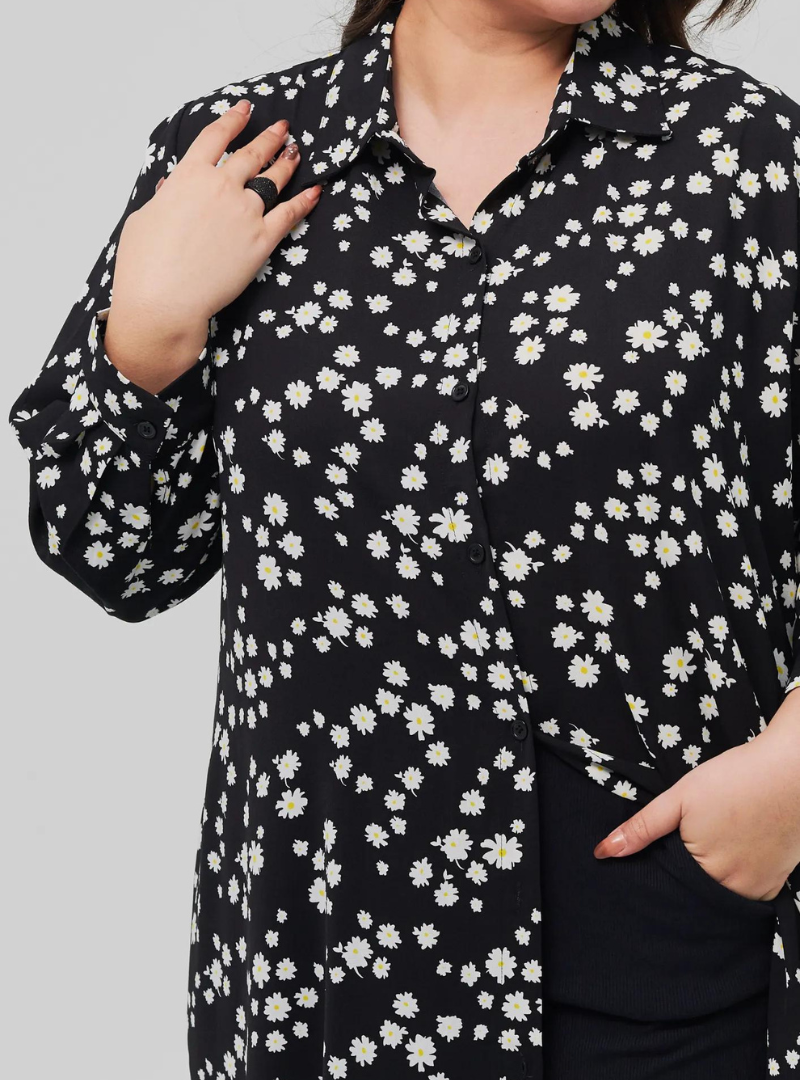 A woman dressed in Black Daisy Longline Printed Shirt Dress