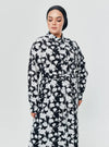 A woman dressed in Black Dandelion Longline Printed Shirt Dress