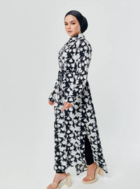 A woman dressed in Black Dandelion Longline Printed Shirt Dress