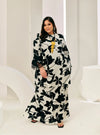 A woman dressed in Black Daun Tun Rokiah Printed Kurung Pahang