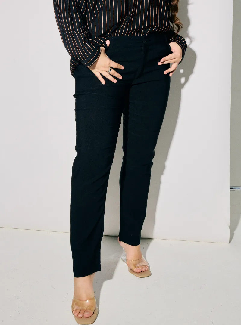 A woman wearing Black Dolly Skinny Trouser