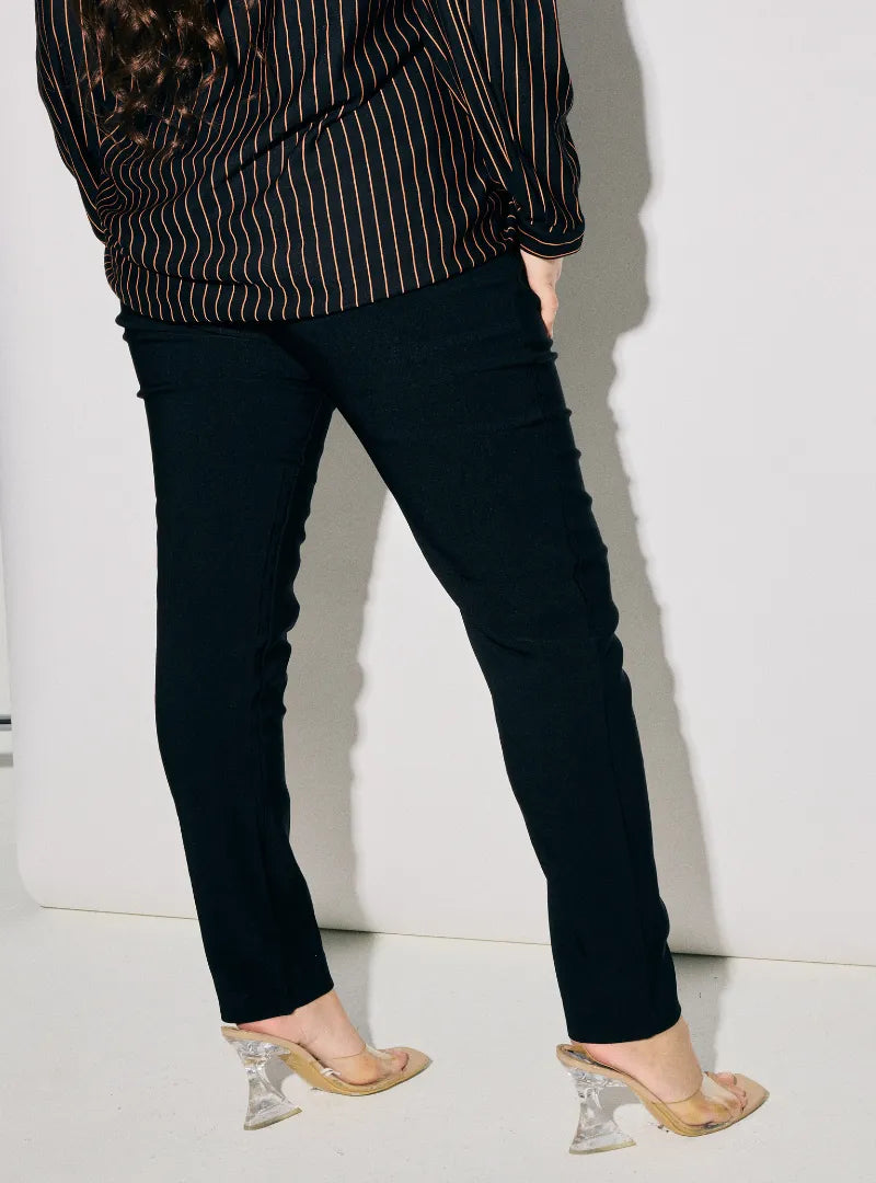 A woman wearing Black Dolly Skinny Trouser