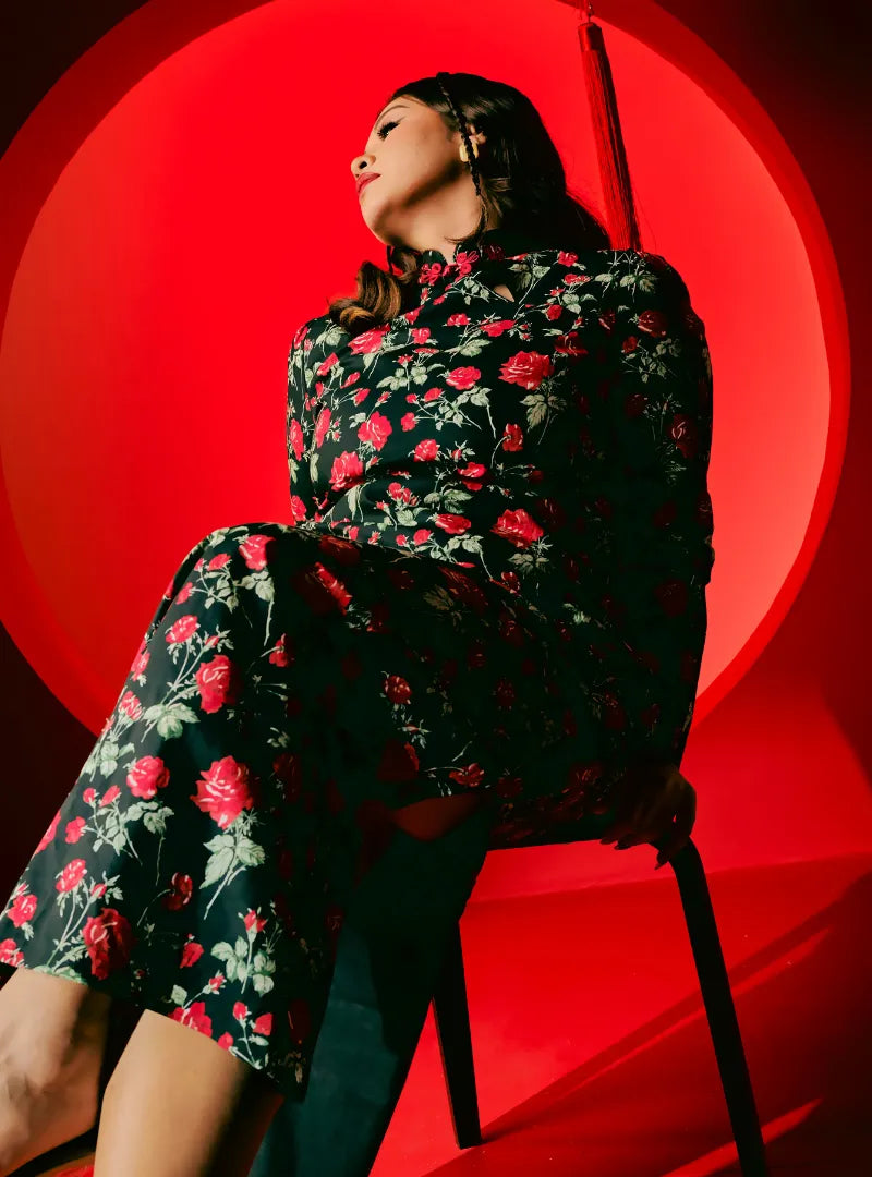 A woman dressed in Black Fung Jie Cheongsam Dress