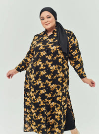 A woman dressed in Black Gold Flower Longline Printed Shirt Dress