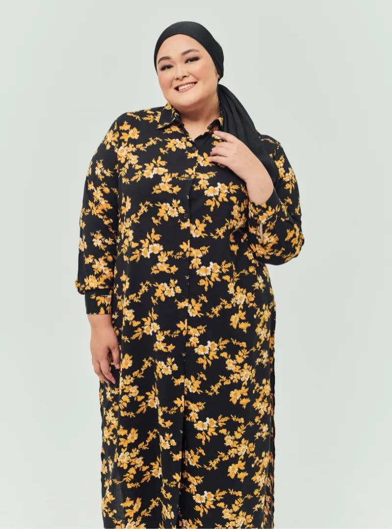 A woman dressed in Black Gold Flower Longline Printed Shirt Dress