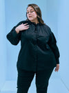 A woman dressed in Black Hanah Cotton Doll Top