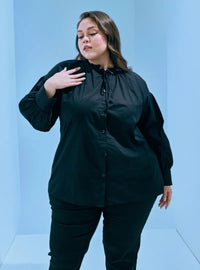 A woman dressed in Black Hanah Cotton Doll Top