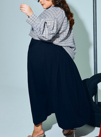 A woman wearing Black Harper Poplin Skirt