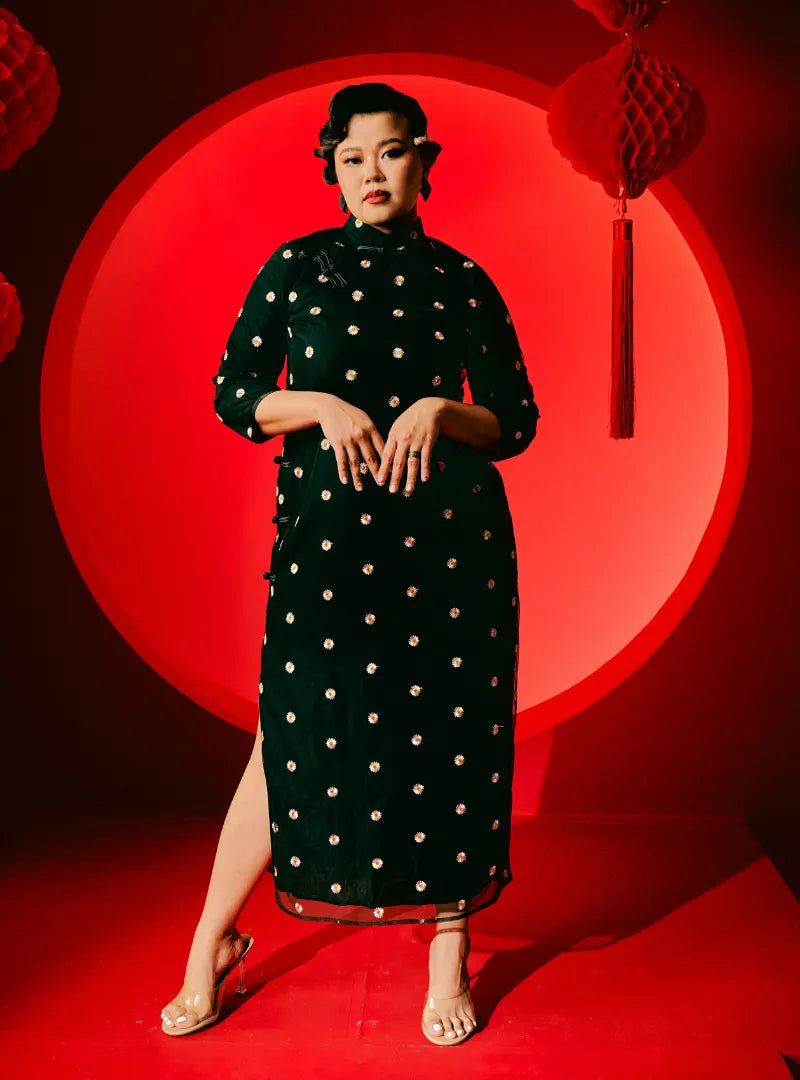 A woman dressed in Black Hong Gu Embroidered Daisy Cheongsam Dress