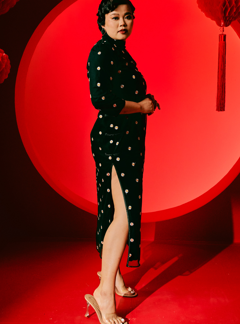 A woman dressed in Black Hong Gu Embroidered Daisy Cheongsam Dress