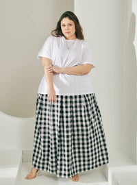 A woman wearing Black Jane Checked Skirt