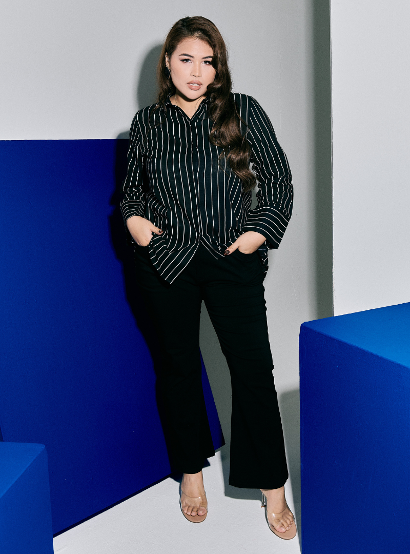 A woman wearing Black Janiper Striped Shirt