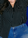 A woman wearing Black Janiper Striped Shirt