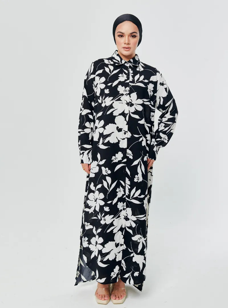 A woman dressed in Black Lotus Longline Printed Shirt Dress