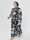 A woman dressed in Black Lotus Longline Printed Shirt Dress