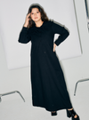 A woman dressed in Black Marsya Cotton Long Sleeve Dress