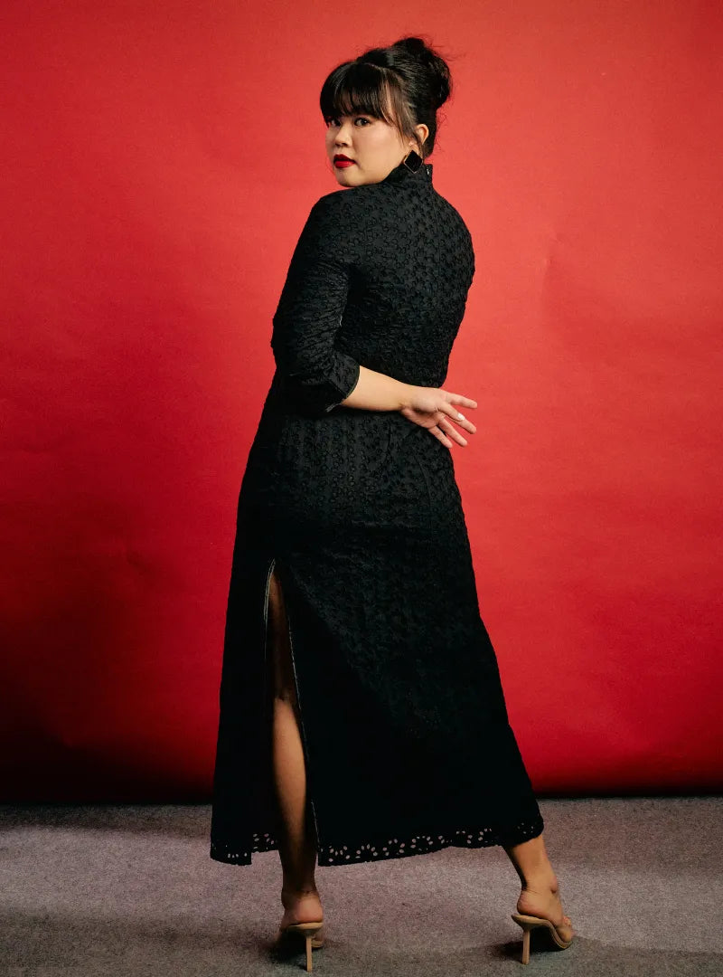 A woman dressed in Black Mi Gu Eyelet Cheongsam Dress