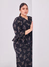 A woman dressed in Black Padi Tun Umaiyah Padi Chiffon Wrap Kurung