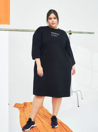 A woman dressed in Black Smooth Cotton T-Shirt Dress