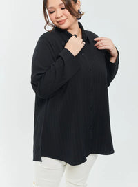 A woman dressed in Black Textured Shirt