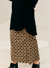 A woman wearing Black Timor Print Songket Skirt