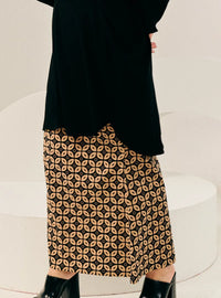 A woman wearing Black Timor Print Songket Skirt