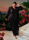 A woman dressed in Black Tun Anisah Kebaya Kurung