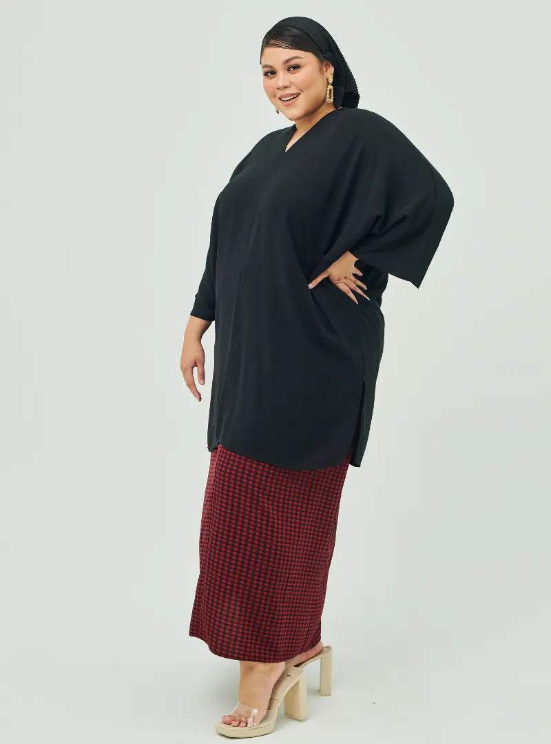 A woman dressed in Black Tun Fatima Kaftan Top