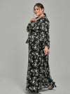 A woman dressed in Black Tun Sarah 3D Chiffon Wrap Kurung