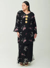 A woman dressed in Black Tun Zahira Naabi Lace Kurung