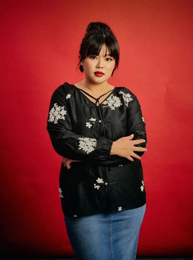 A woman dressed in Black Wong Gu Embroidered Cheongsam Top